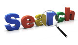 Eine Lupe gerichtet auf das Wort "Search" in bunten Buchstaben.
