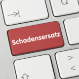 Taste "Schadensersatz" auf einer Computertastatur