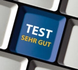 Taste mit Aufschrift "Test - sehr gut"