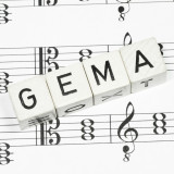 GEMA- Würfel auf einem Notenblatt