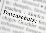 Gesetzesauszug auf dem das Wort Datenschutz zu erkennen ist, der Rest ist nur verschwommen zu sehen