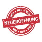 Runder roter Button Neuerffönung