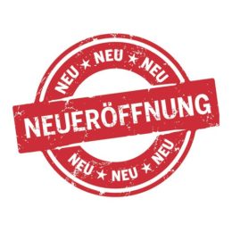 Runder roter Button Neuerffönung