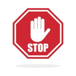 rotes Schild mit weißer Hand und dem Wort "STOP"