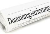 Schriftzug Domainregistrierung auf einer Tageszeitung