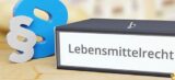 Fotolia_266608651: Ordner mit der Beschriftung "Lebensmittelrecht. Daneben zwei Paragrahpen in grau und blau