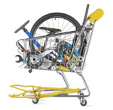Gelber Einkaufswagen mit Fahrradteilen