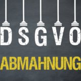 DSGVO Buchstaben hängend über Abmahnung