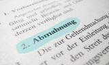 "Abmahnung" blau markiert in einem Gesetzestext