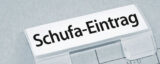 Akte mit Aufschrift Schufa-Eintrag