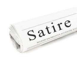 Zeitung mit Aufschrift Satire