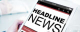 Tablet mit DIsplaybeschriftung Headline-News